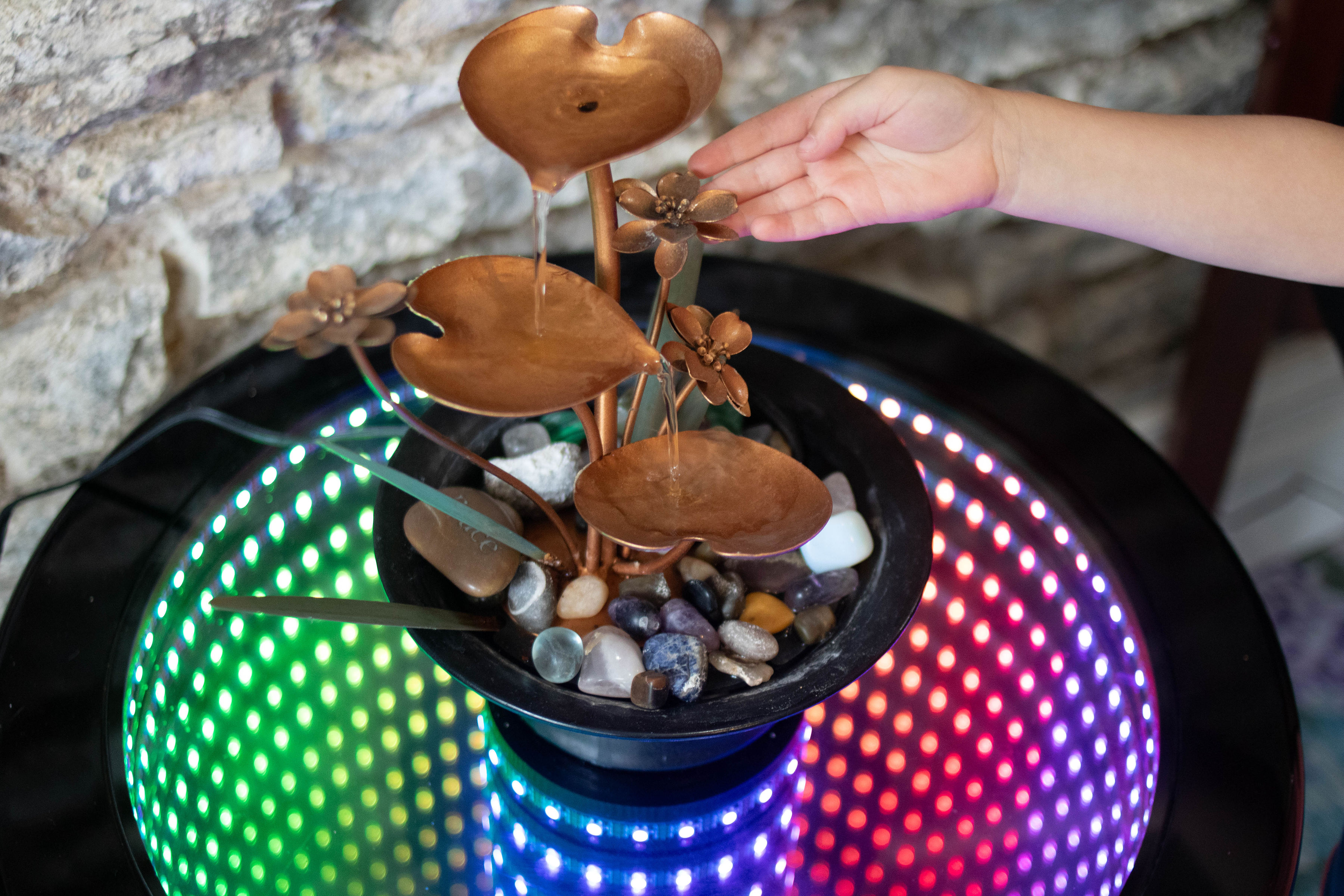Water fountain and colorful light table